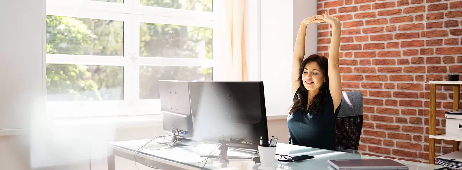 Desk Stretch Exercise. Woman Stretching At Work In Office