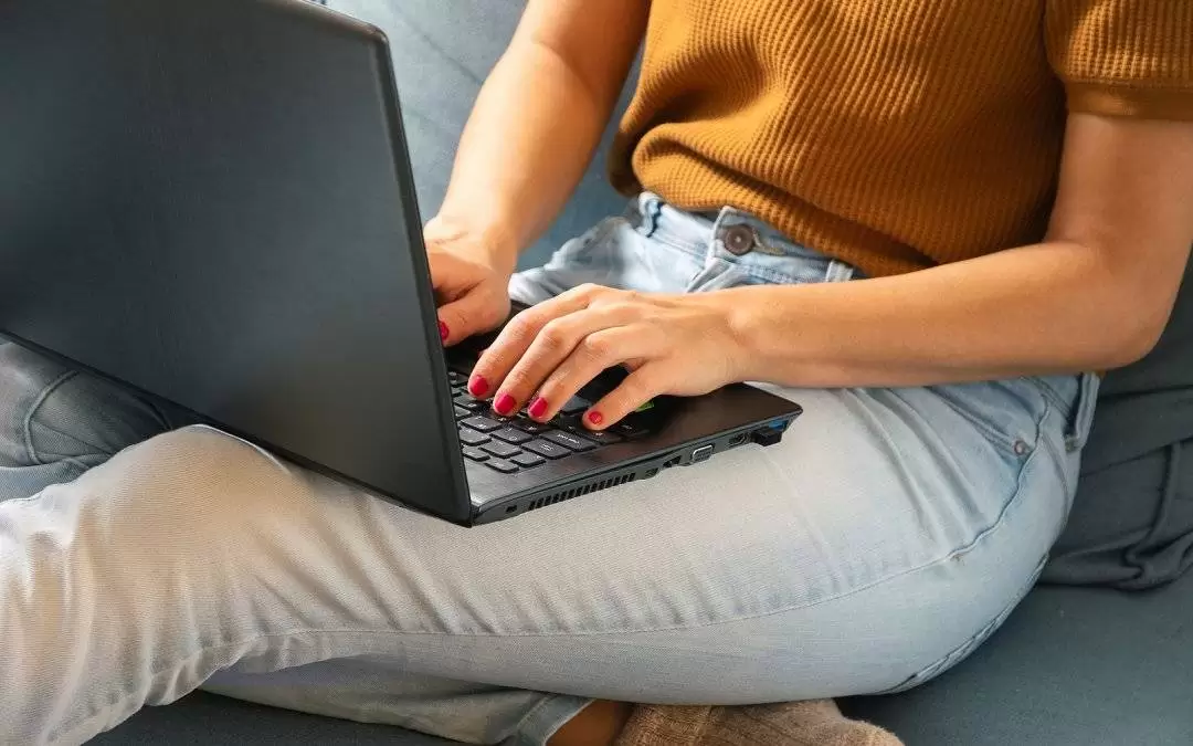 Woman working on laptop from home. Busy people lifestyle. Woman typing on laptop computer. Work from home lifestyle. Urban lifestyle. Woman typing message on laptop computer. Technology lifestyle. Typing message on computer. Laptop computer. Working at ho